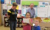Kiwanis visit BES Third Graders with a special gift…